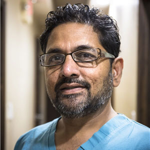 Portrait of Dr Milan Gandhi